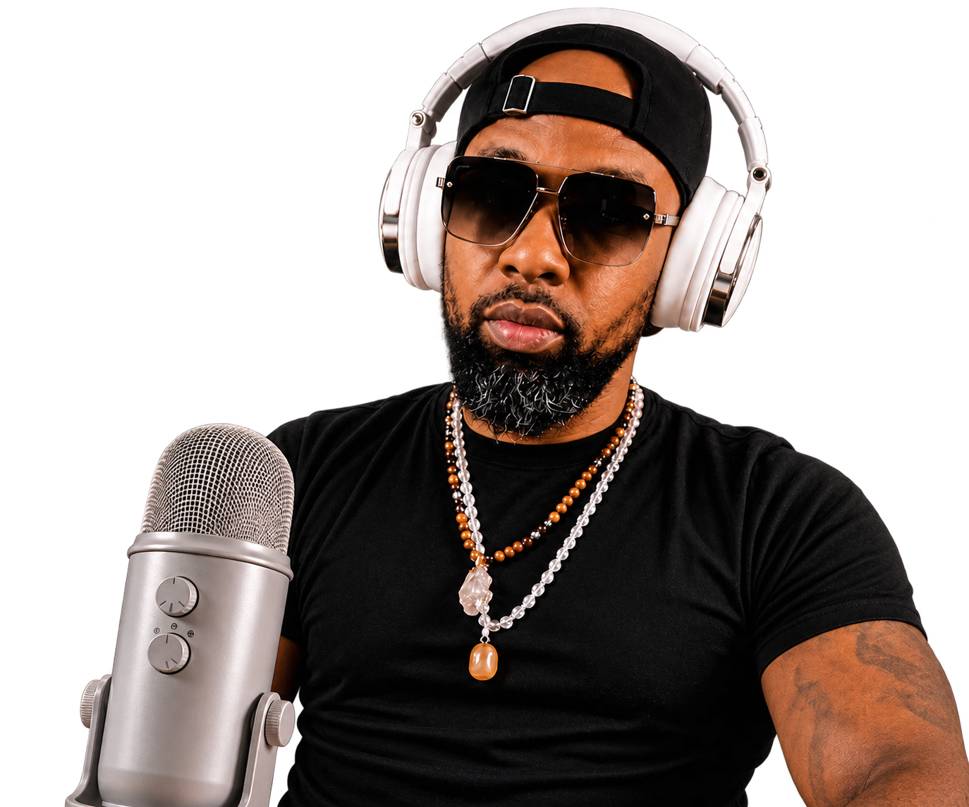 LifeCoach Ivan J. wearing headphones beside a microphone